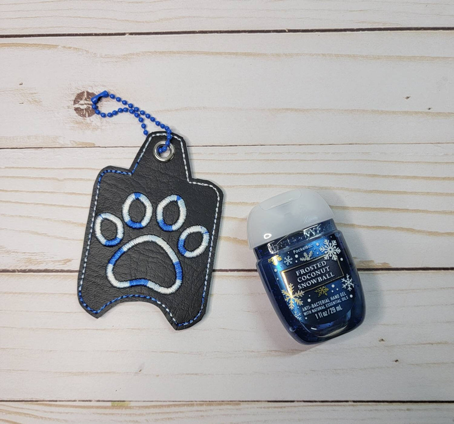 Variegated blue and white paw print// Hand sanitizer holder/ keychain/ embroidered
